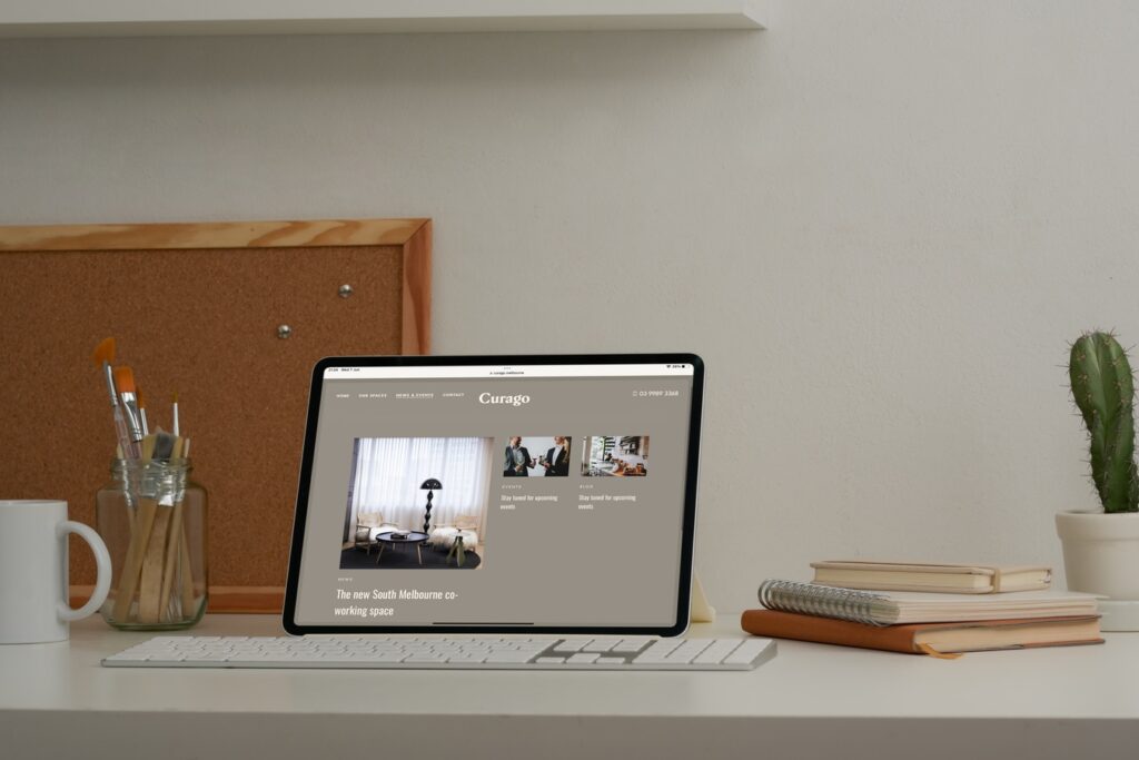 Curago website shown on a tablet at a desk