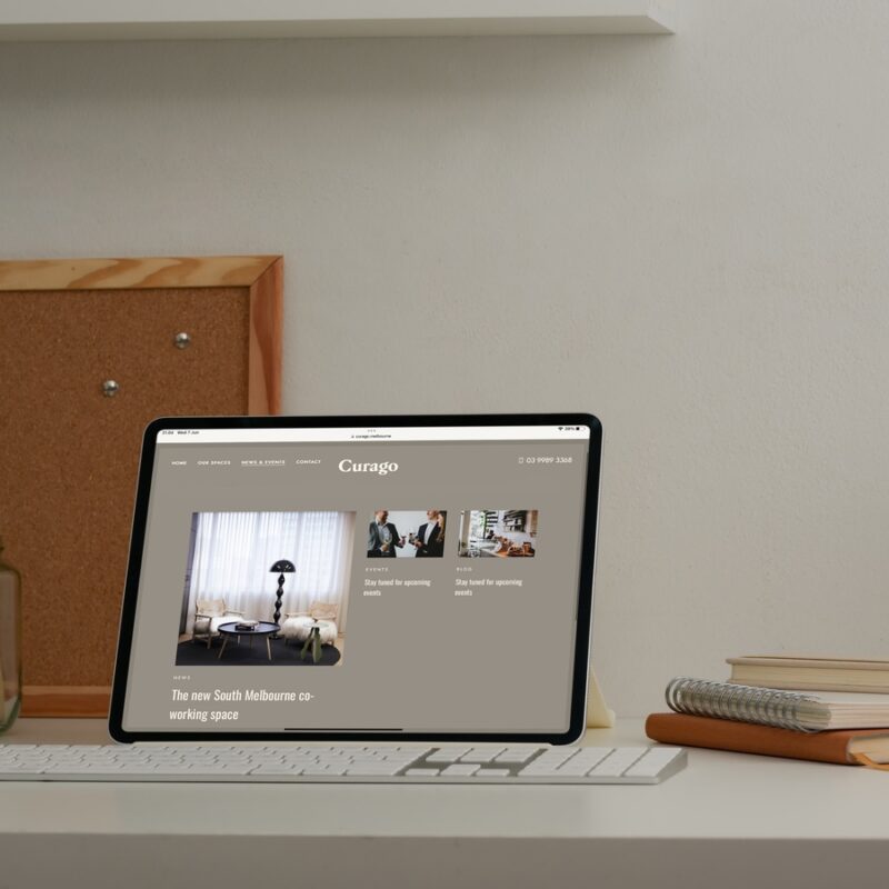 Curago website shown on a tablet at a desk
