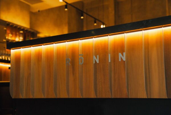 Rōnin name cut into the backlit timber bar front